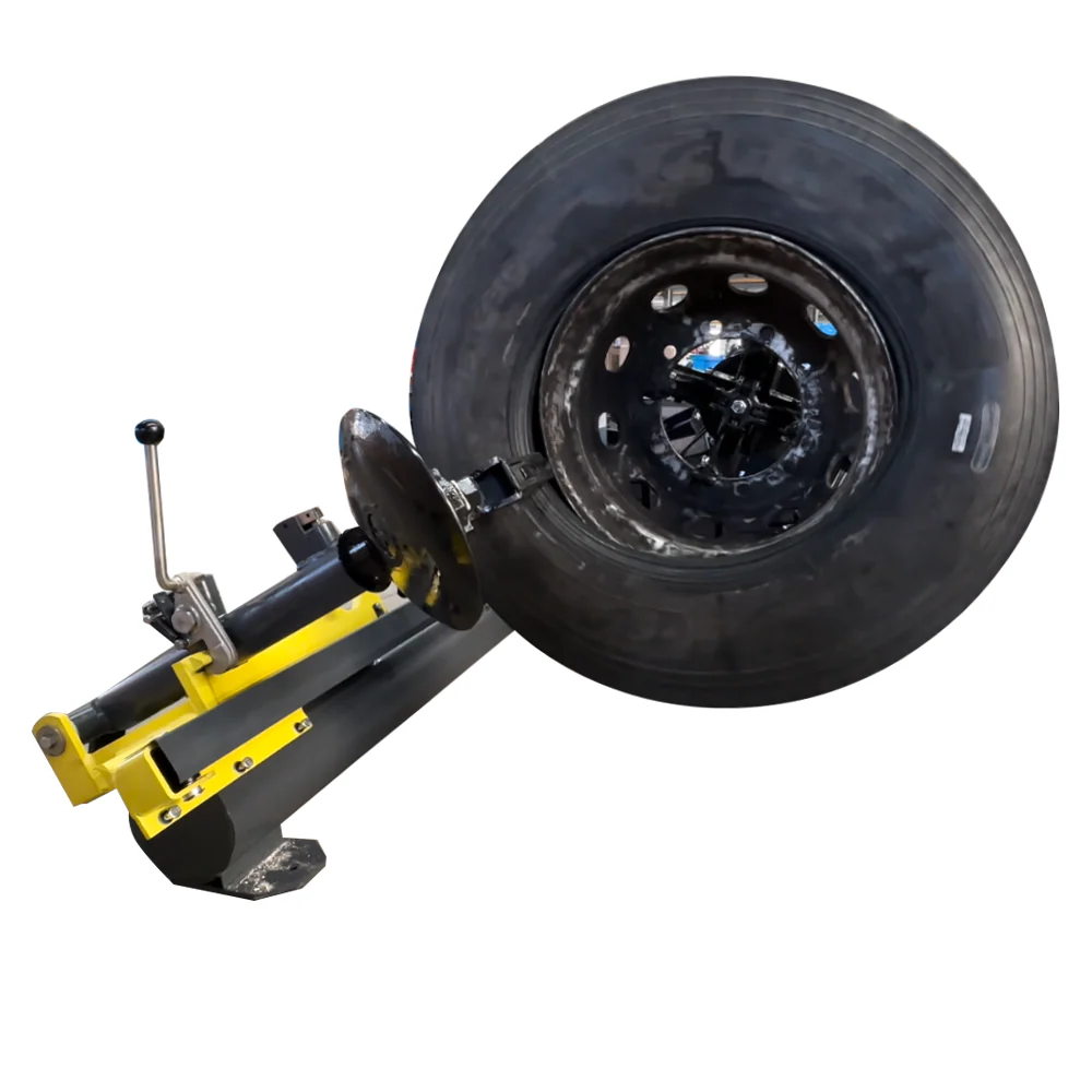 Truck tire changer with wheel clamp arms and black mounting head on yellow base