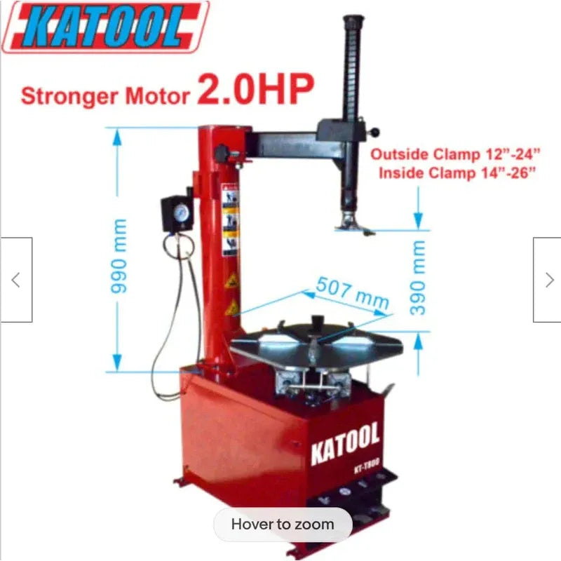 Red and gray tire changer with vertical clamp arm and circular mounting plate