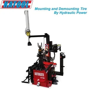 Hydraulic tire changer on red base with upright lever and mounting head
