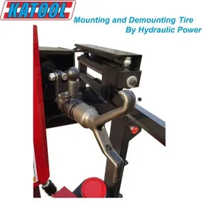 Tire changer arm assembly with metal tool holder on red machine