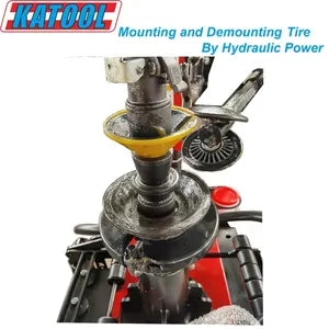 Tire changer spindle and clamp assembly with wheel rim and protective cover