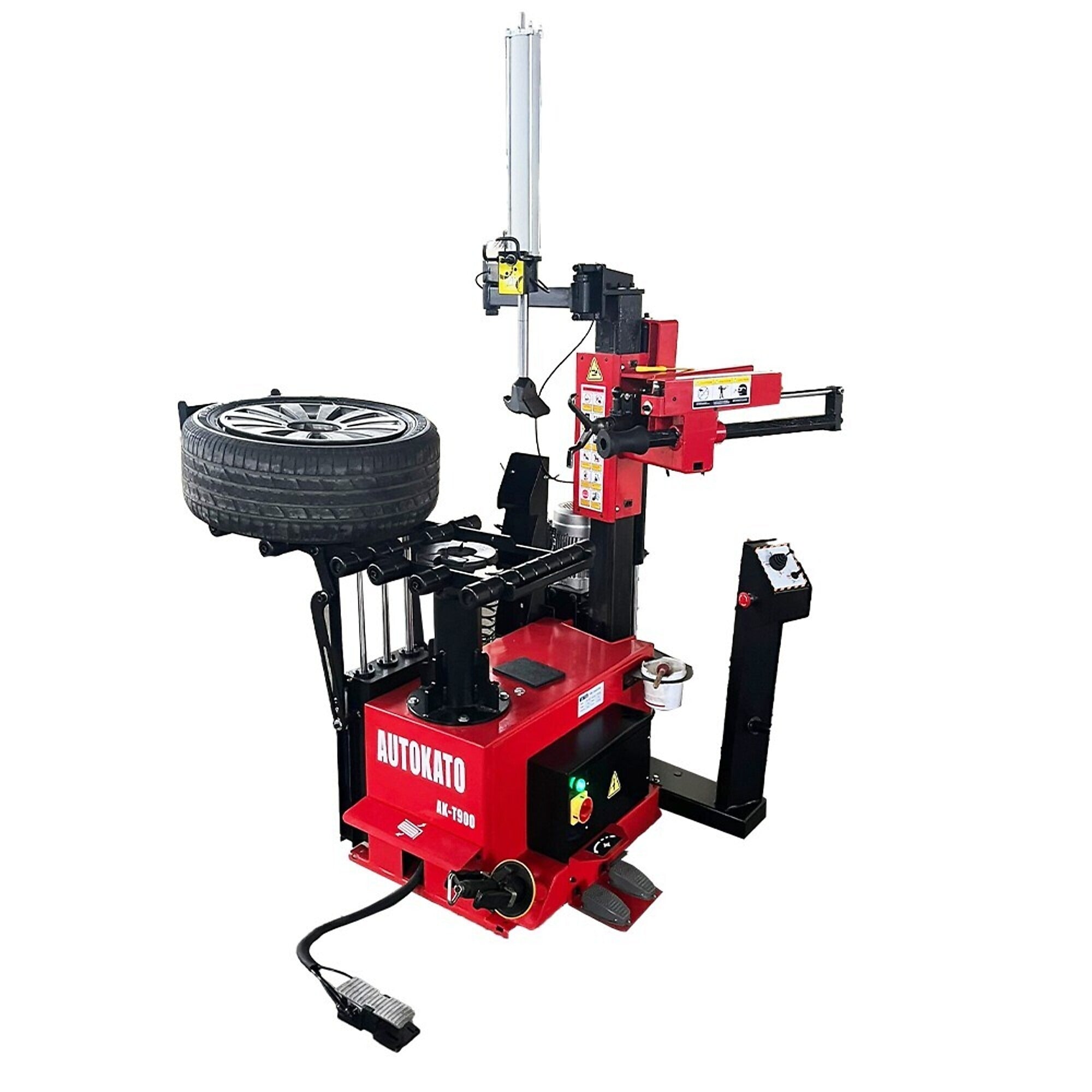 Katool tire changer with red base and mounted wheel on rotating clamps