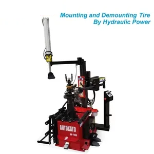 Katool tire changer with hydraulic lift arm and red base unit
