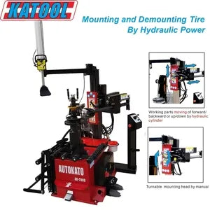 Katool tire changer with red base and hydraulic mounting arm assembly