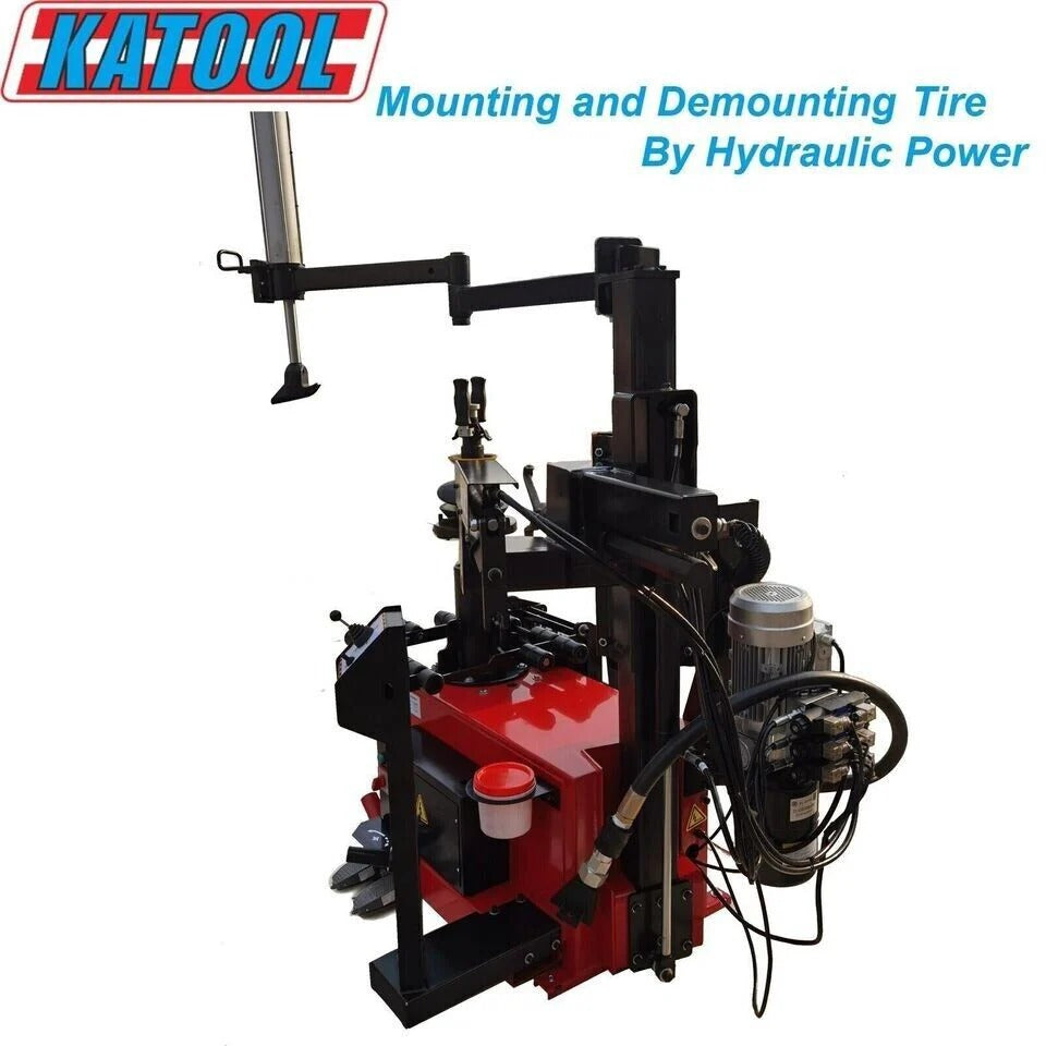 Hydraulic tire changer machine with red control unit, black posts, and cables