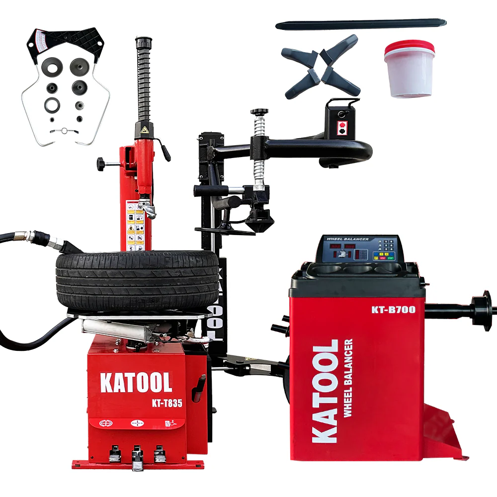 Tire changer and wheel balancer combo with mounted tire on red base machines