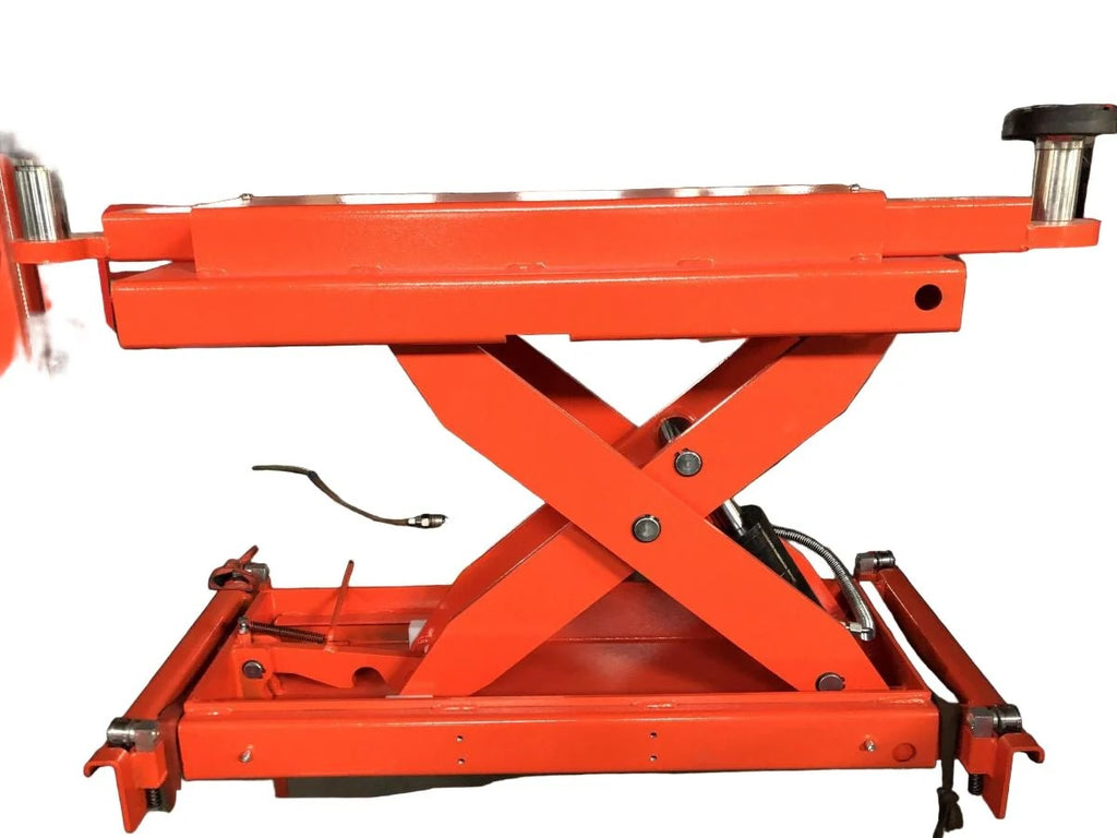 Orange scissor lift rolling jack with lifting platform, arms, and side control lever