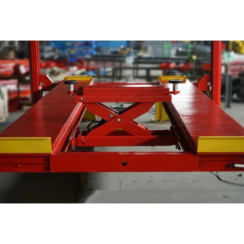 Red scissor lift rolling jack base with X-frame lifting mechanism and platform blocks
