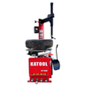 Tire changer with red-and-black wheel clamp and upright bead-breaking arm
