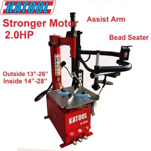 Tire changer with red stand, assist arm, and bead seater platform