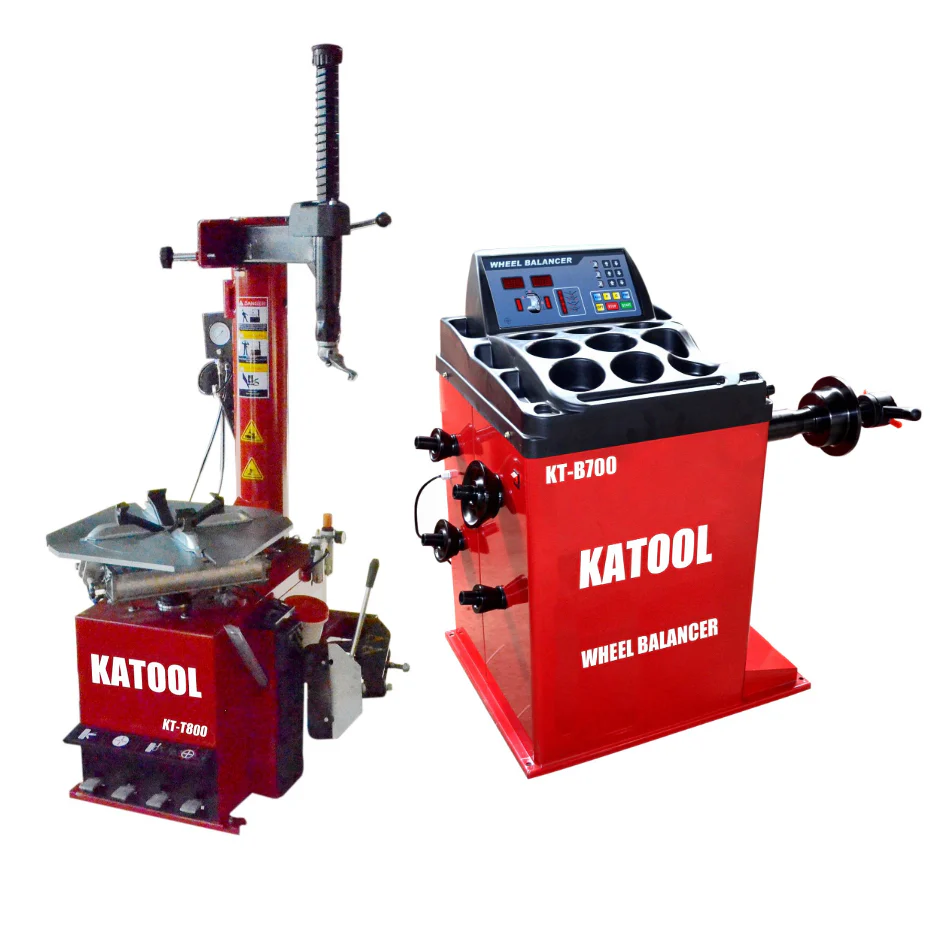Red tire changer and red wheel balancer machines side by side, standalone units