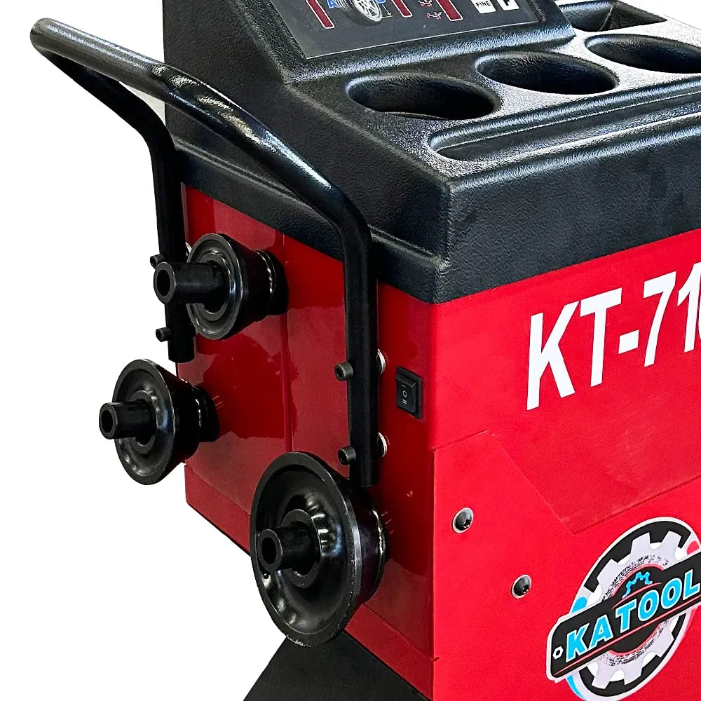 Katool wheel balancer side housing with logo, black support rollers, and red body
