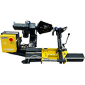 Heavy-duty tire changer with black and yellow base, bead breaker arm, and mounting head