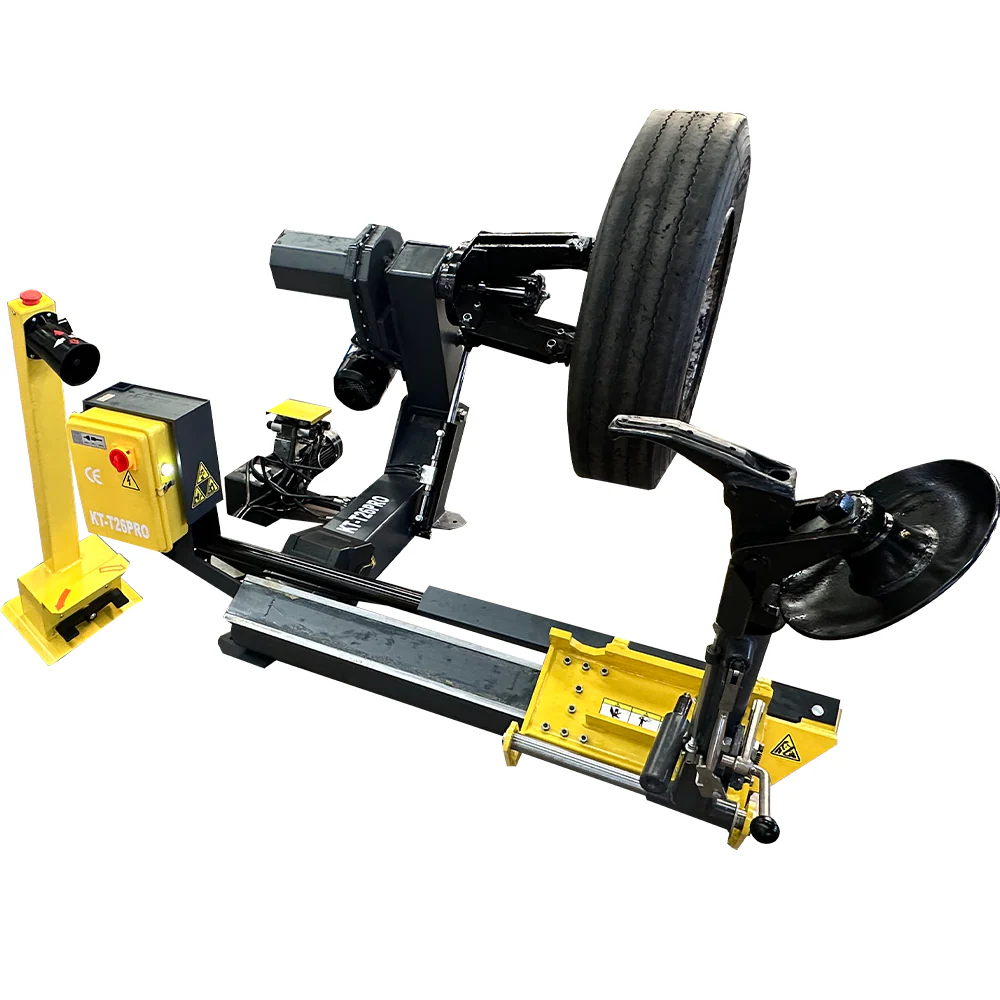 Truck tire changer with yellow control box, black frame, and wheel lifting arm