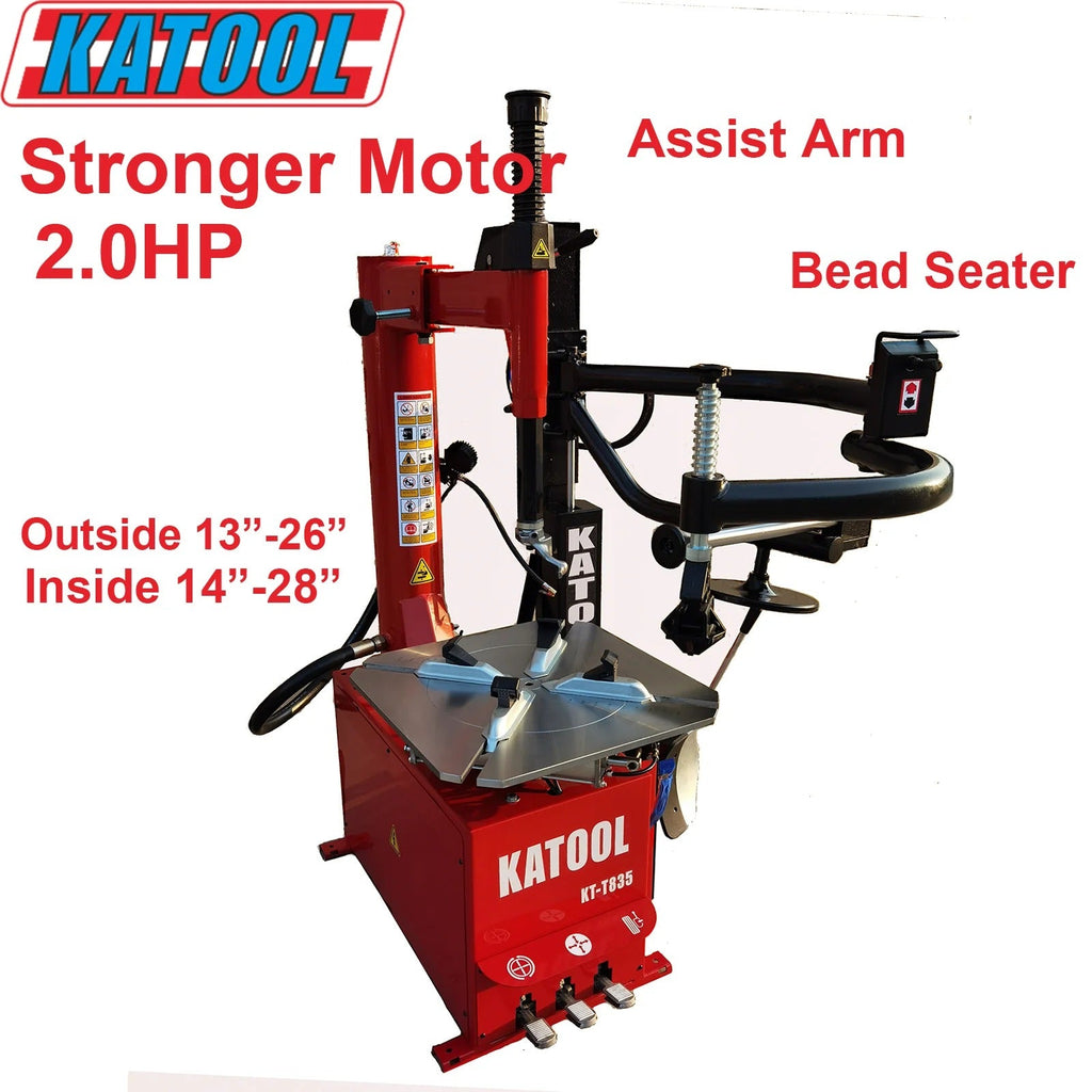 Tire changer machine with red body, black bead seater, and assist arm
