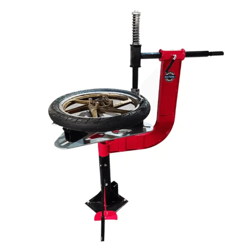 Manual motorcycle tire changer with red lever and black mounting post