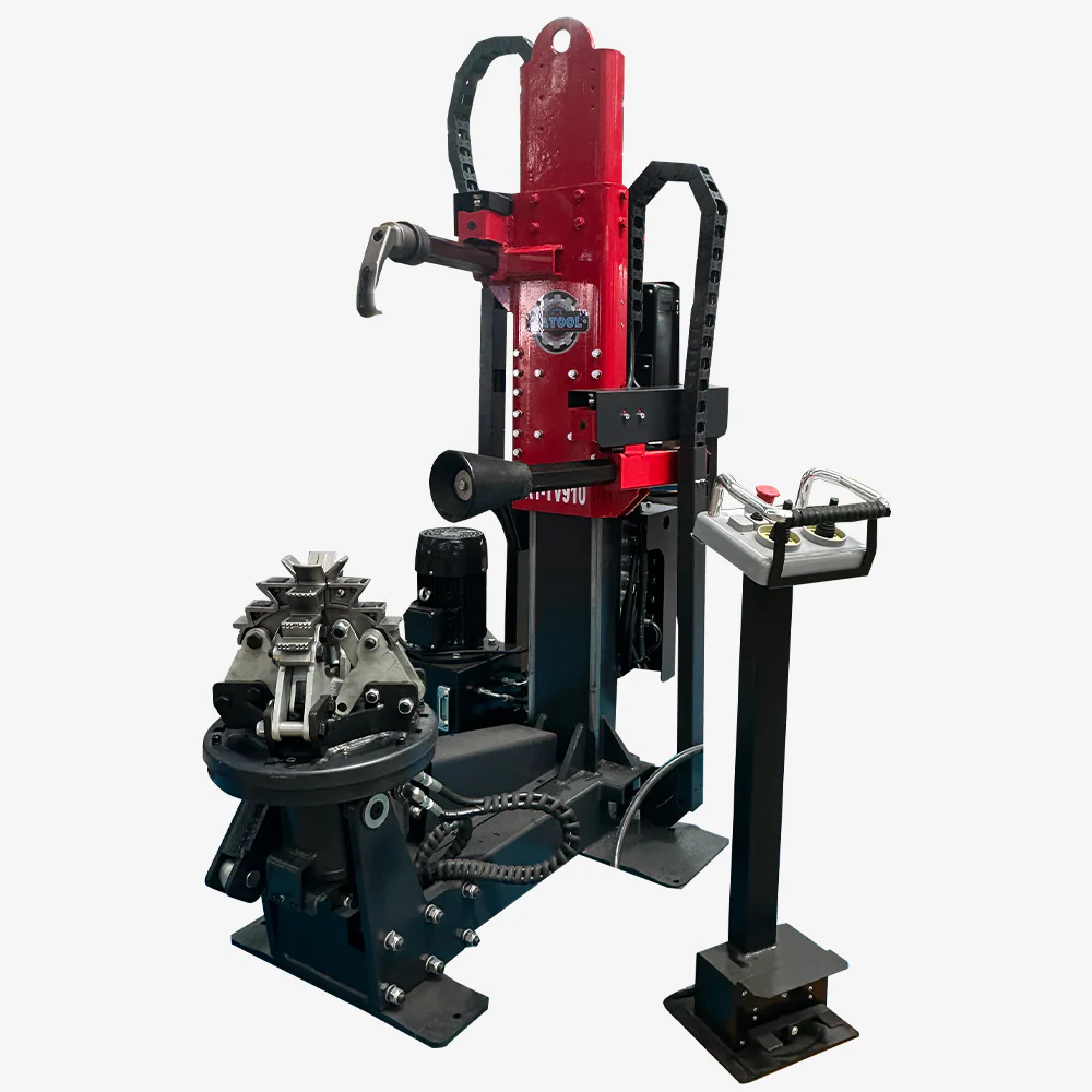 Hydraulic tire changer with red stand, black work base, bead tool, and gripper arm