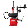 Double-arm tire changer with bead blaster, red and black, with tire on turntable