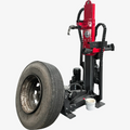Hydraulic tire changer with red frame, black base, clamp arm, and mounting plate