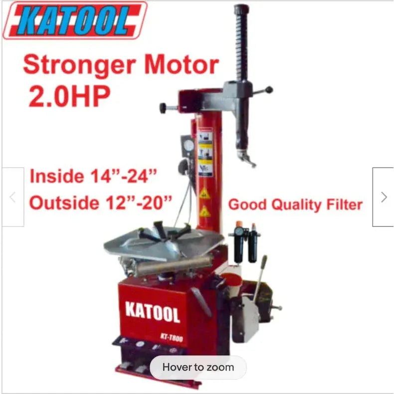 Red tire changer machine with metal mounting head and front bead-breaker base