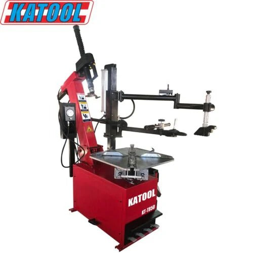 Red tire changer machine with overhead arm and clamp assembly