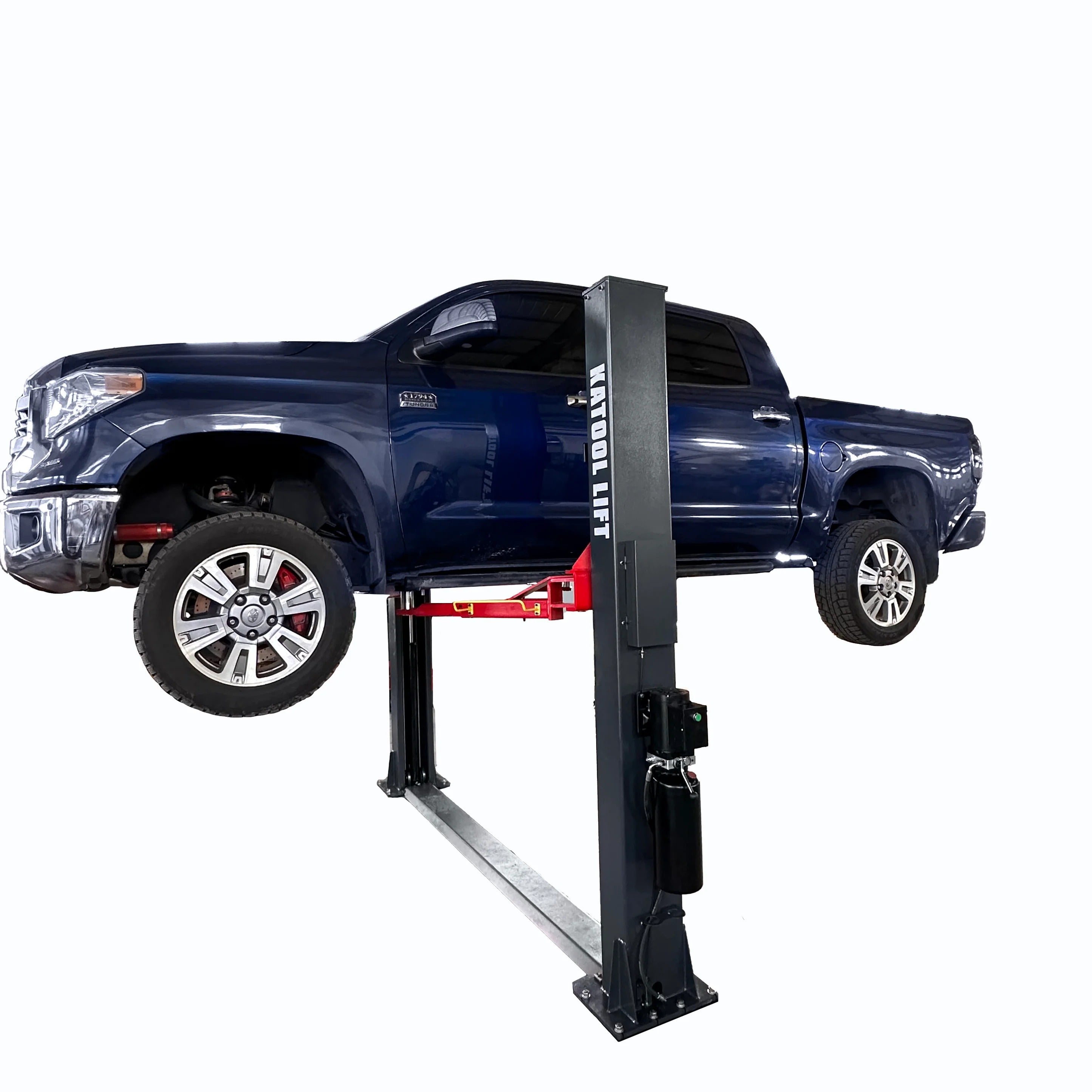 Two-post vehicle lift with a blue pickup truck positioned on the arms