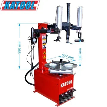 Red tire changer with two vertical lift towers, turntable, and side clamp arms