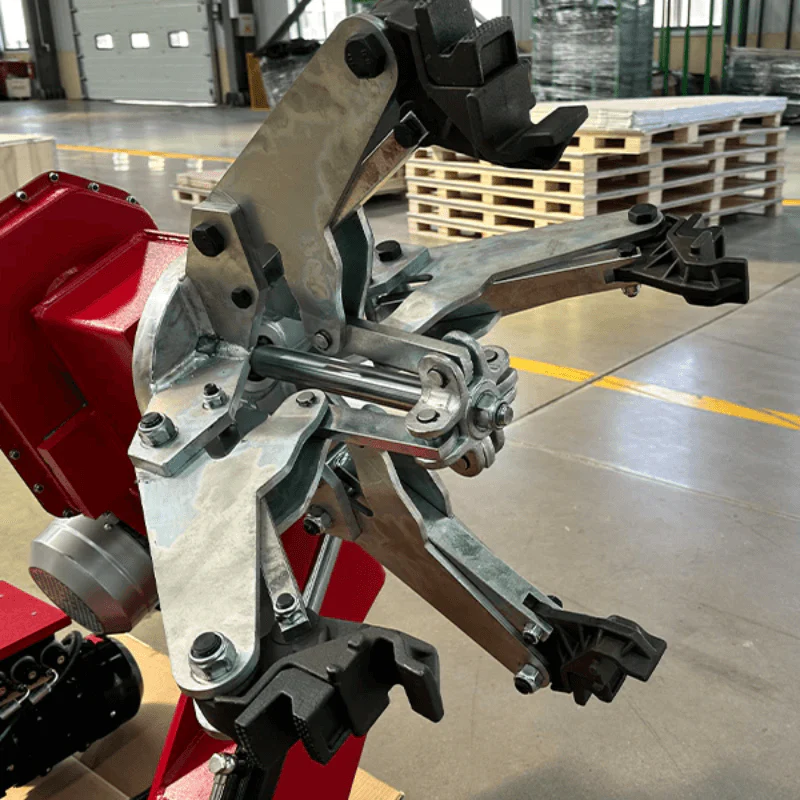 Bead breaker and wheel mounting tool assembly on red tire changer machine