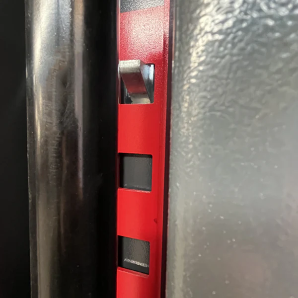 Red lift post latch area with metal pin inside guide slot