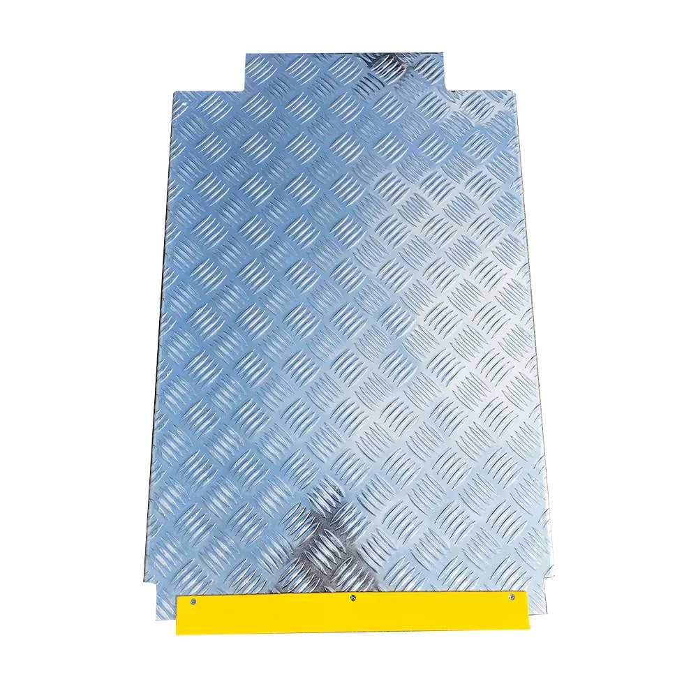 Diamond-plate lift platform insert with blue-gray metal texture and yellow edge stop.