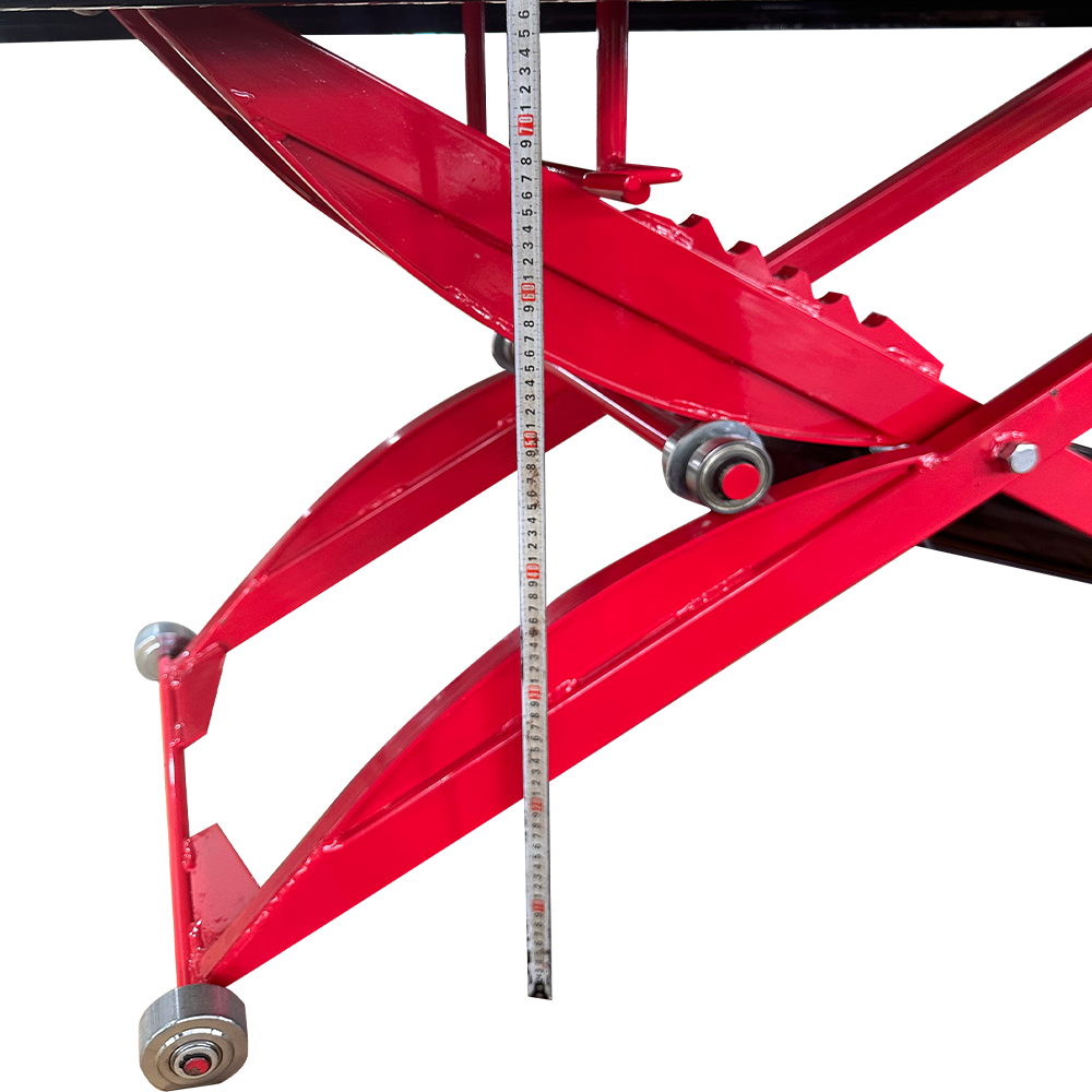 Hydraulic motorcycle lift height scale and roller near red crossbeam