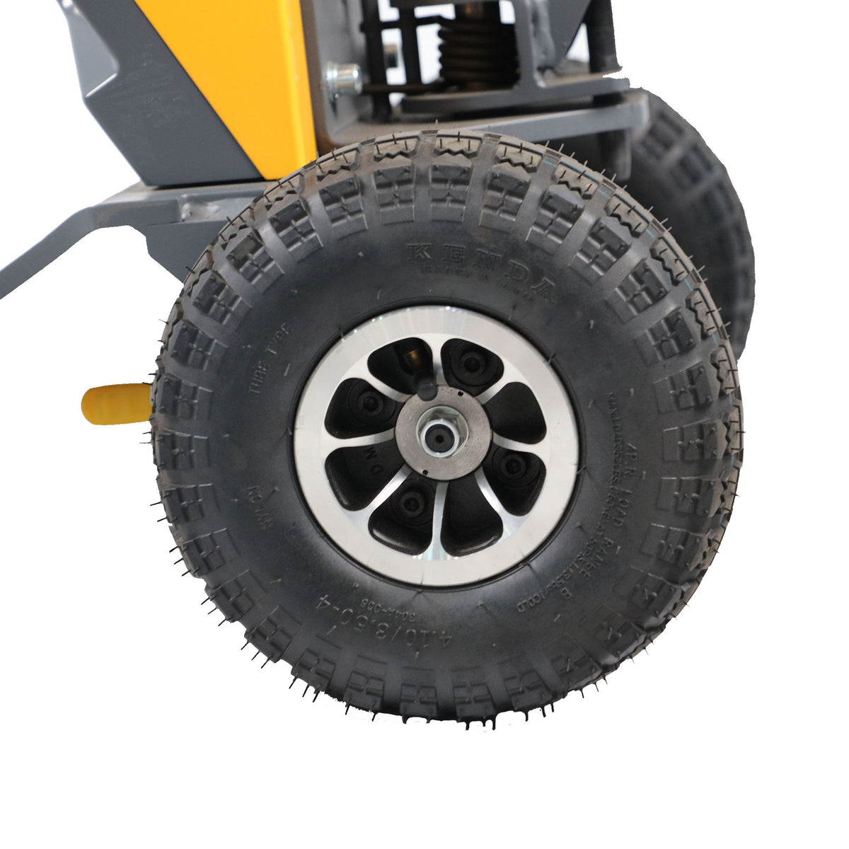Rugged black tires with multi-spoke wheel hub on gray and yellow tugger