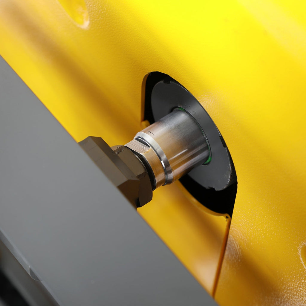 Stacker side charging port with round metal cap on yellow housing